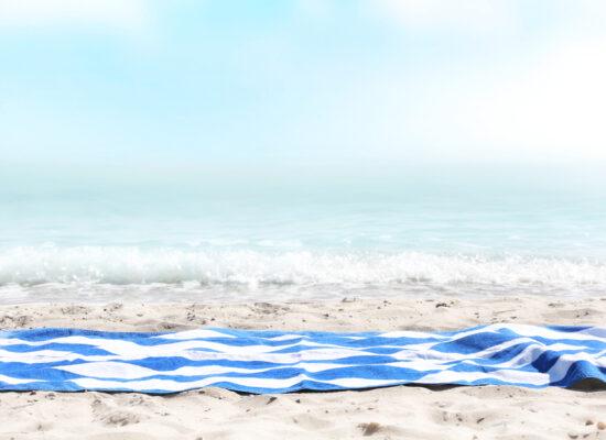 Arbemu towels - beach-blue-stripped-towel-on-sand, supplier, wholesaler in Turkey