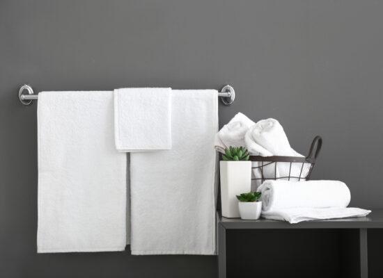 Arbemu towels - white-bath-towels-near-grey-wall, supplier, wholesaler in Turkey