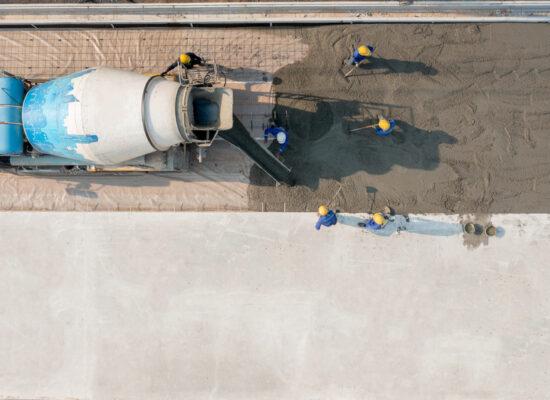 Arbemu, construction material, cement, aerial-view-constuction-worker-pouring-concrete, supplier, wholesaler, in Turkey, Türkei, Turquie